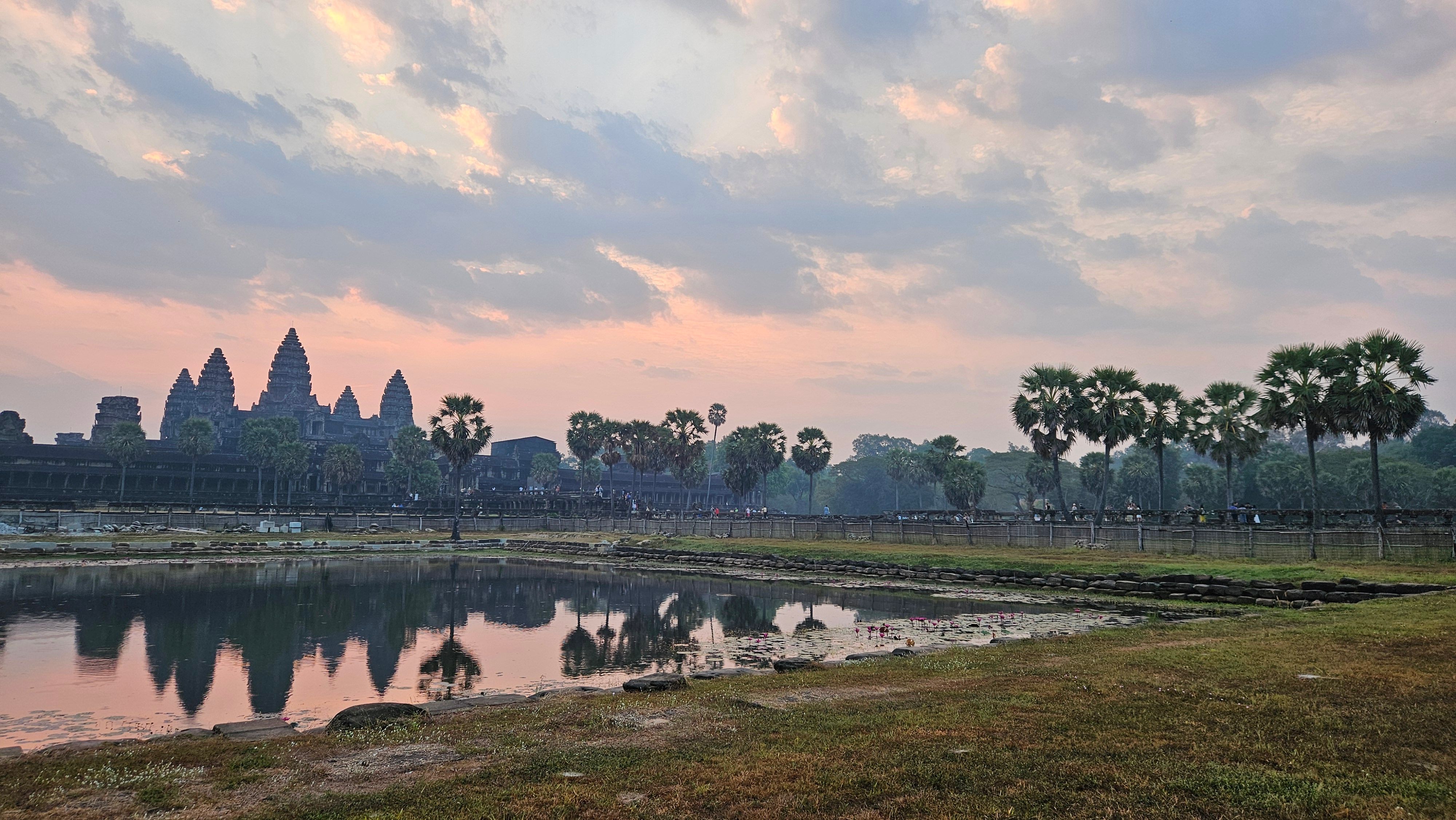Angkor Wat mirrored in its moat at sunset