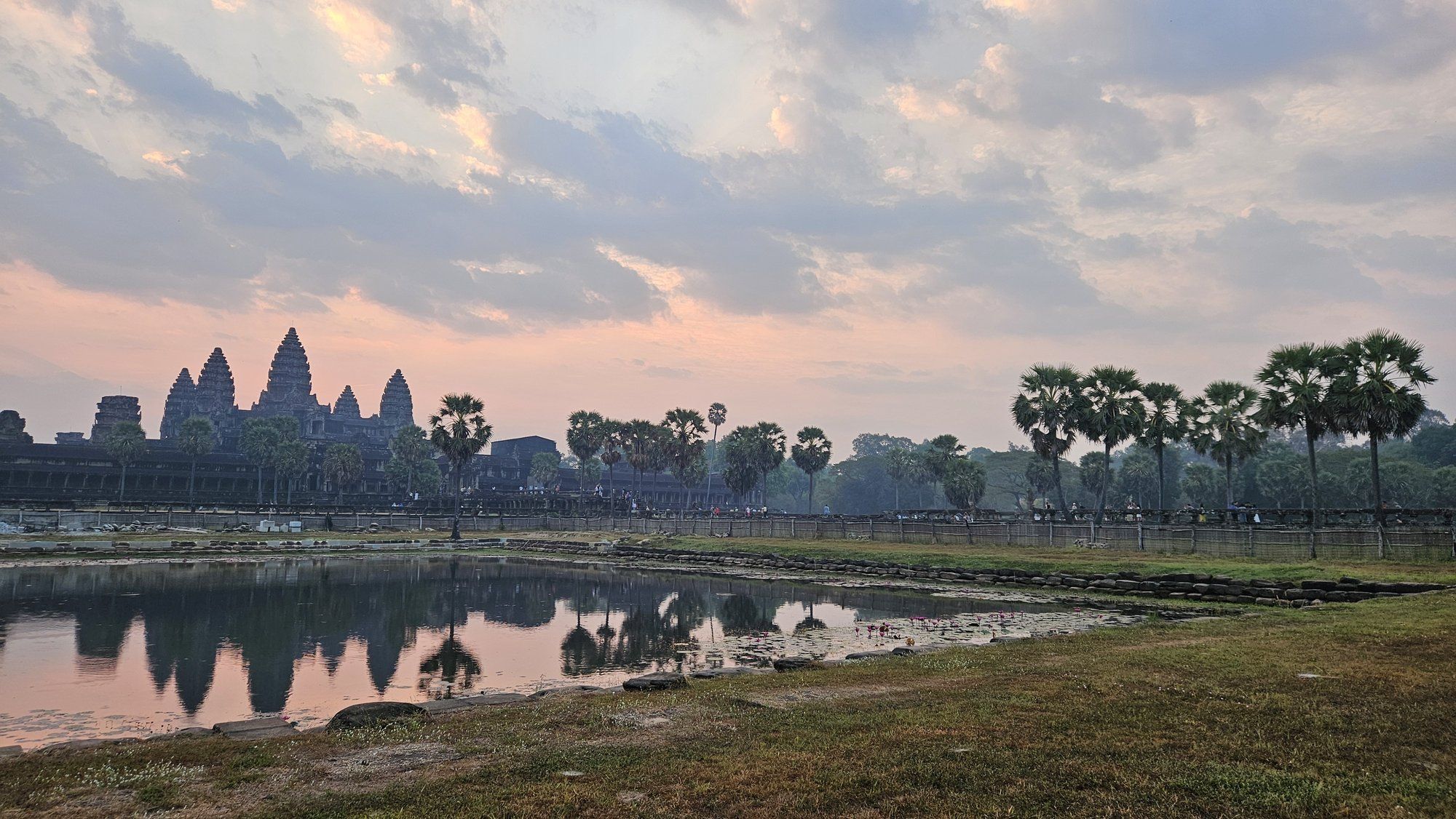 Angkor Wat mirrored in its moat at sunset
