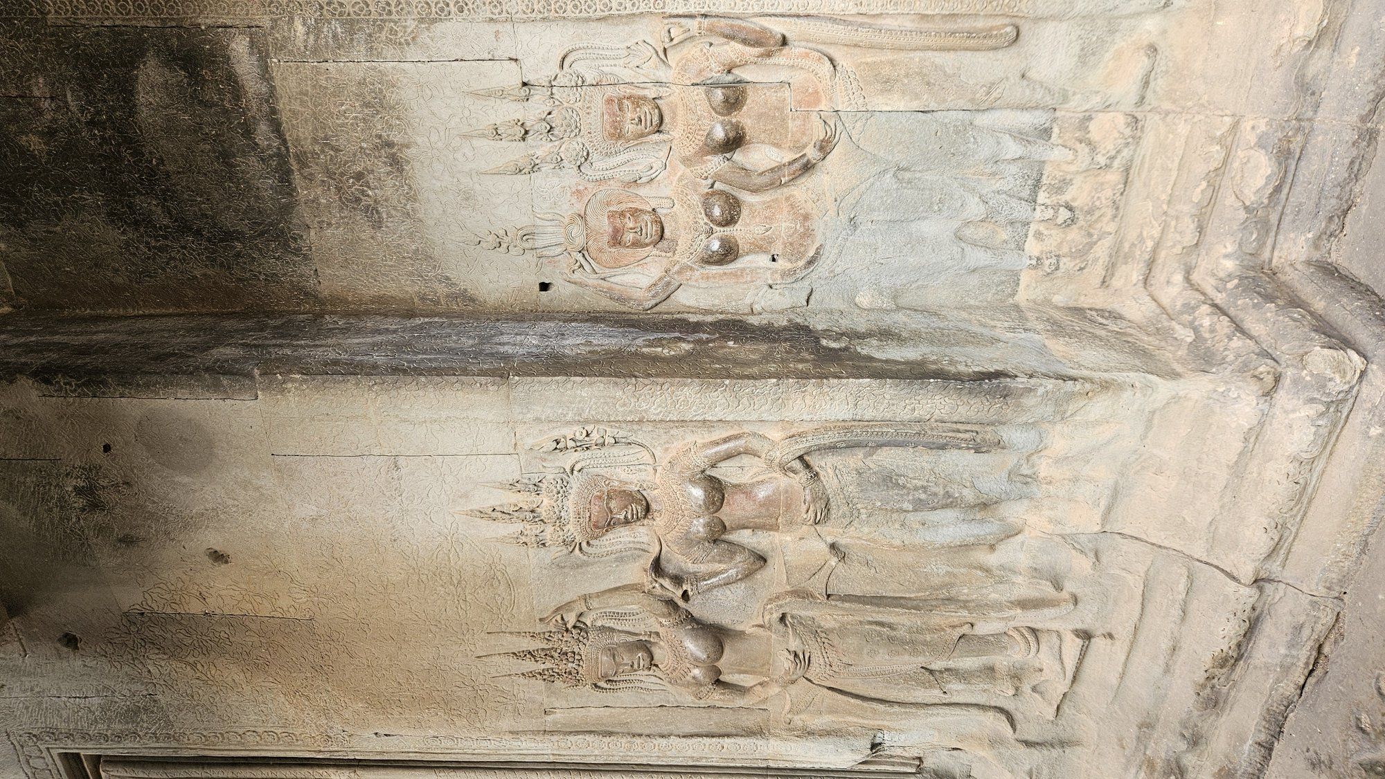 Carved apsara (devata) figures on a wall of Angkor Wat