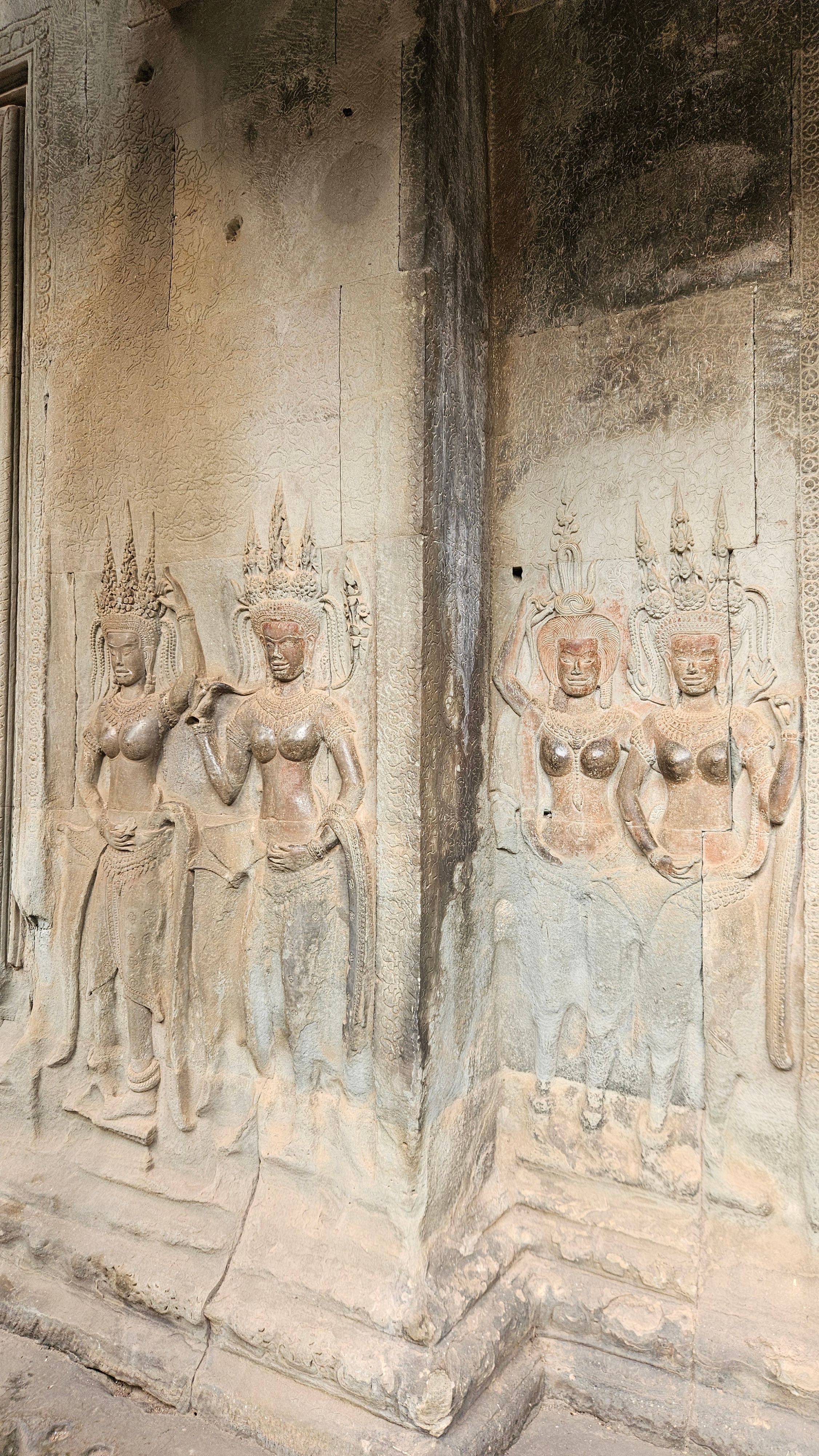 Carved apsara (devata) figures on a wall of Angkor Wat
