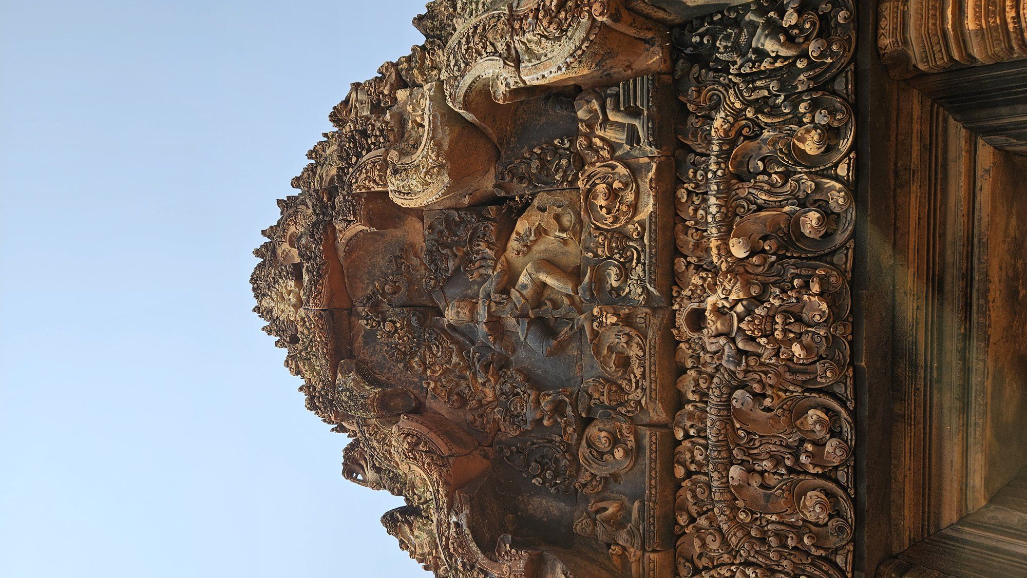 The deep, intricate carving of Banteay Srei's pink sandstone