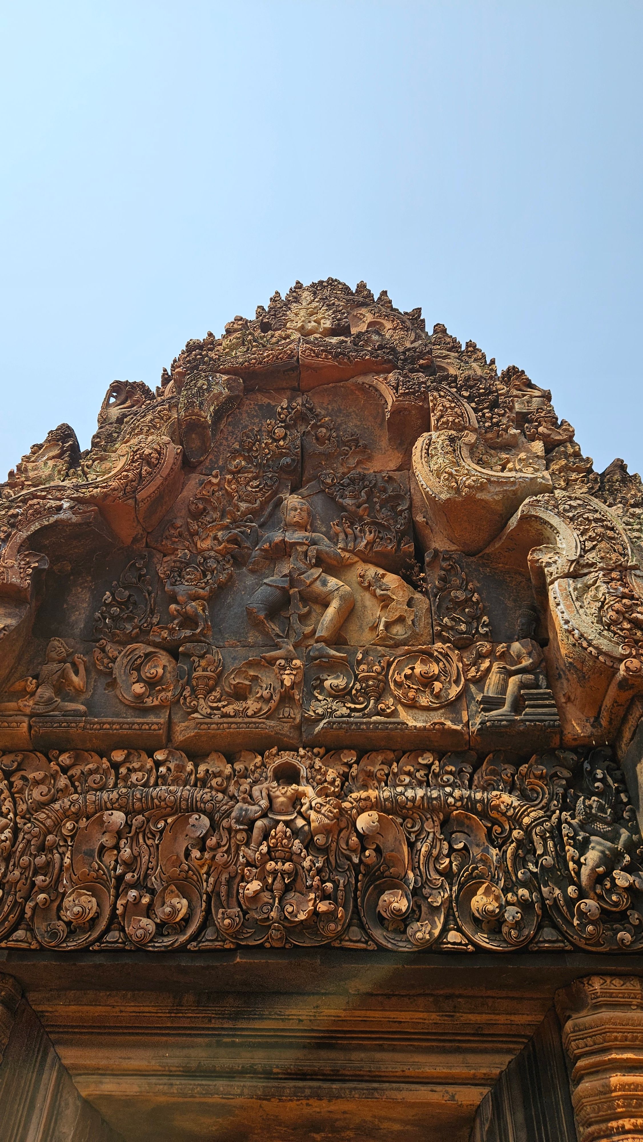 The deep, intricate carving of Banteay Srei's pink sandstone