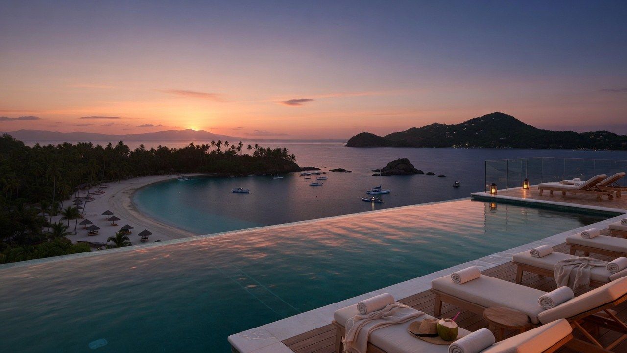 Infinity pool overlooking a tropical island bay at dusk