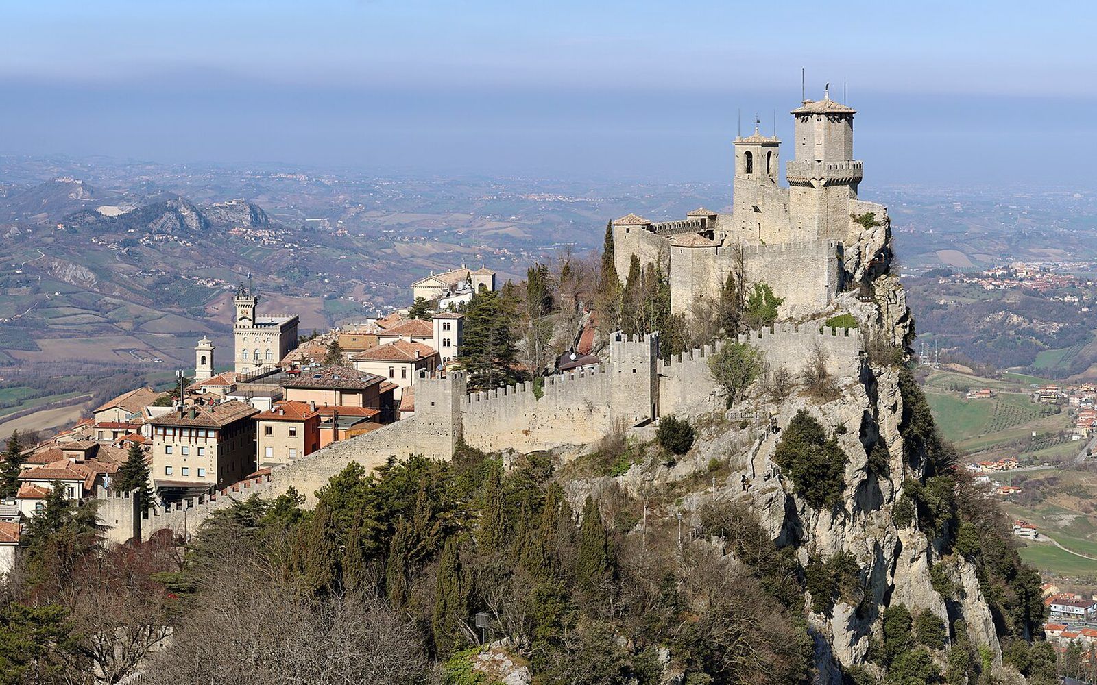 The historic stone streets and terracotta rooftops of San Marino's UNESCO-listed old town climbing the slopes of Monte Titano