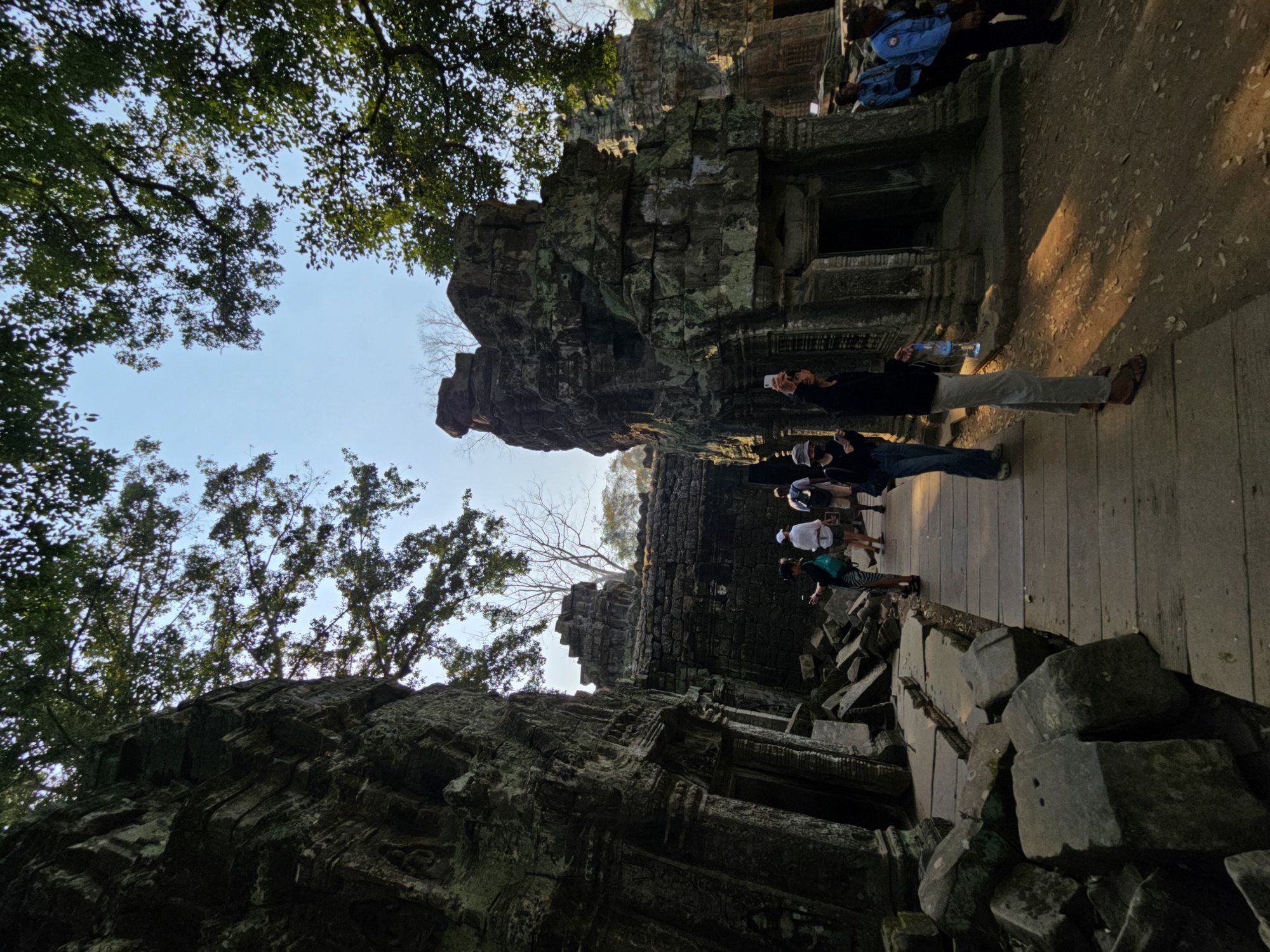 The walkway into Ta Prohm through collapsed stonework