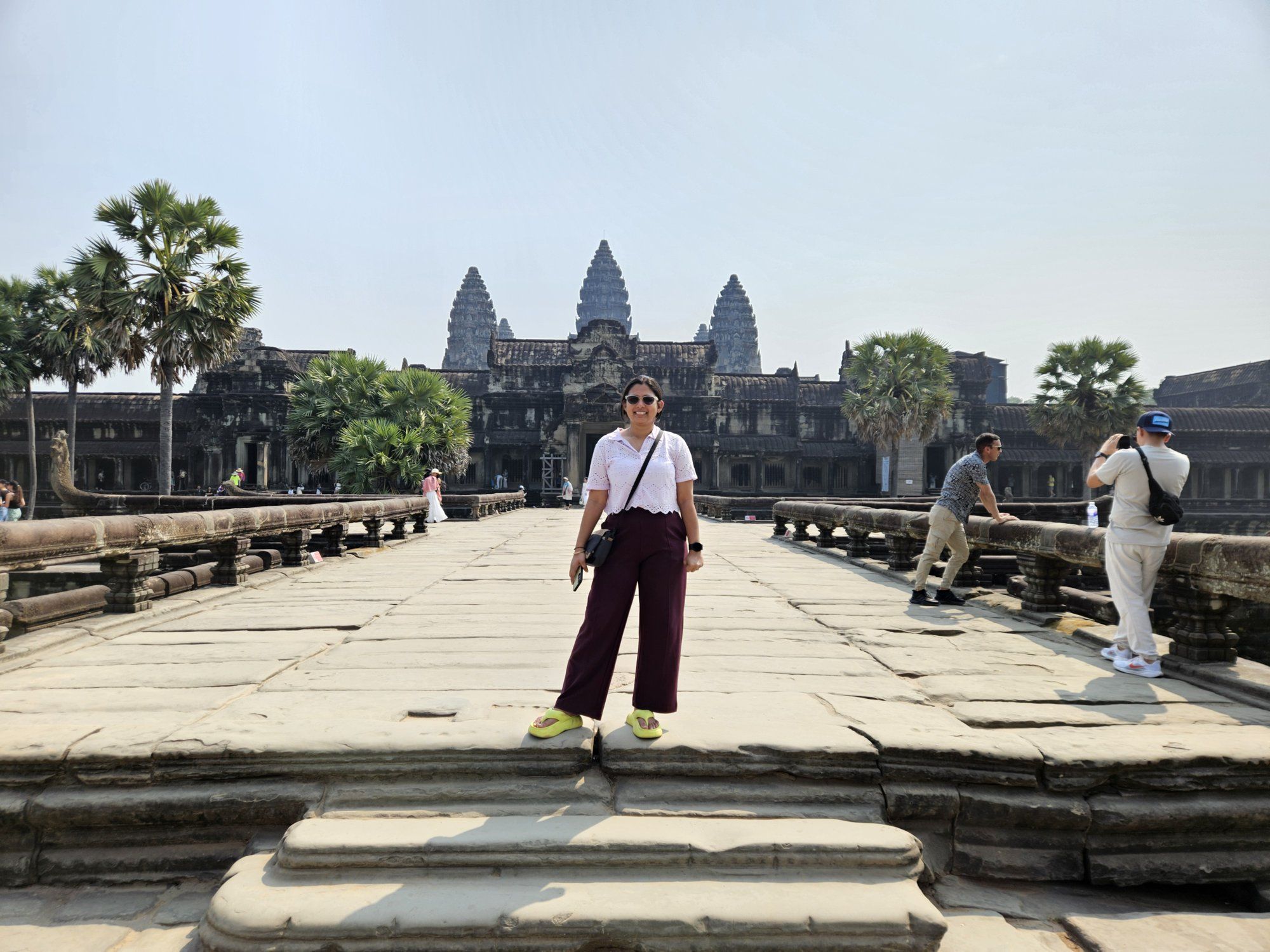 A traveller on the causeway leading to Angkor Wat